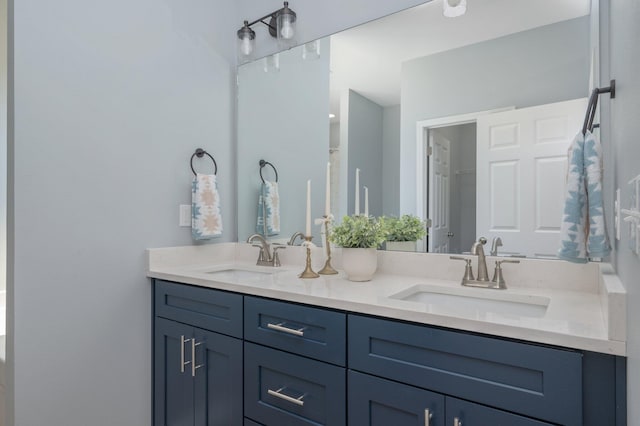 bathroom with a sink and double vanity