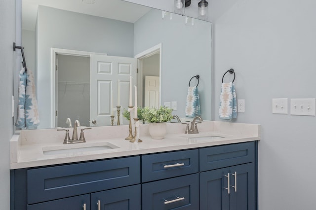 bathroom with double vanity and a sink