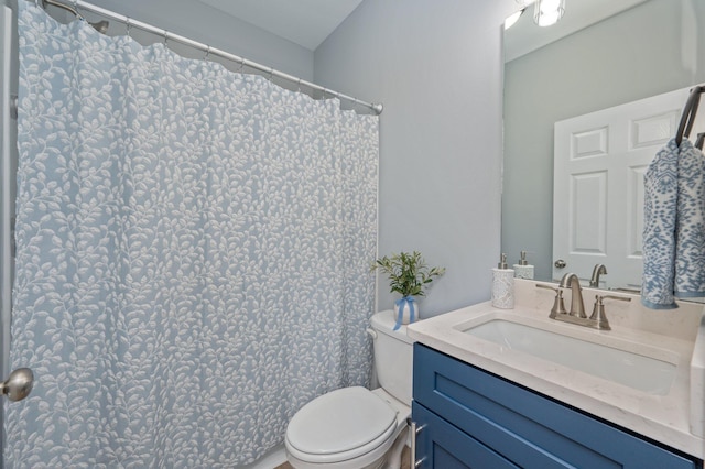 full bathroom featuring toilet and vanity