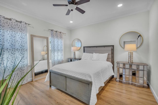 bedroom with baseboards, wood finished floors, and ornamental molding