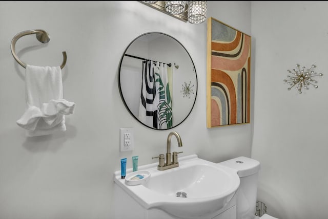 full bathroom featuring toilet and vanity