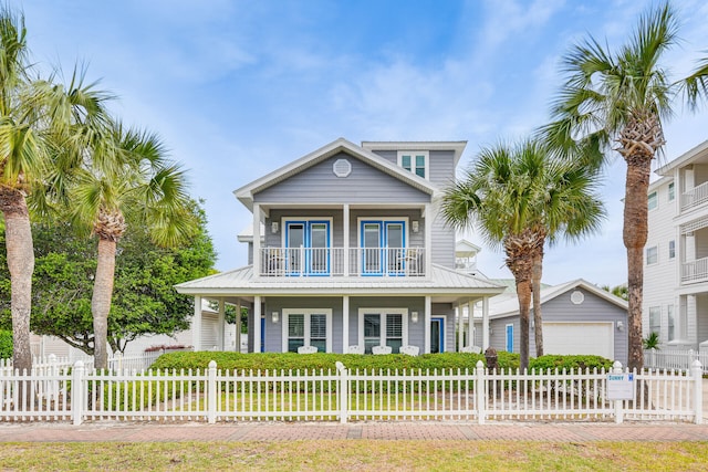 view of front facade with a fenced front yard, a balcony, and a porch