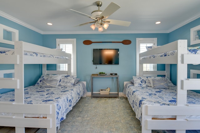 bedroom featuring multiple windows, crown molding, and ceiling fan