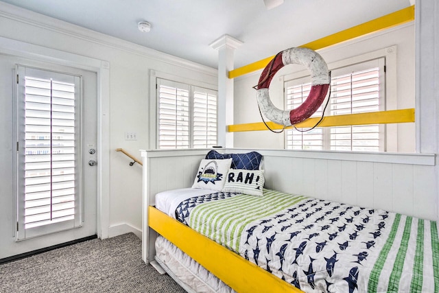 bedroom with carpet floors and crown molding