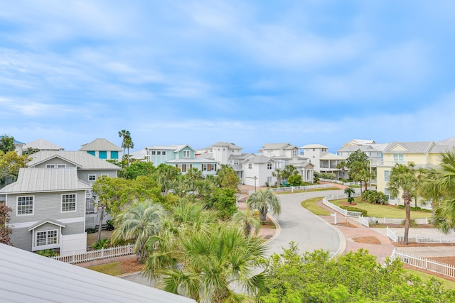 surrounding community featuring fence and a residential view