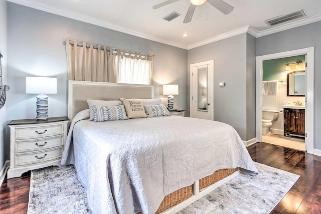 bedroom featuring baseboards, wood finished floors, visible vents, and ornamental molding