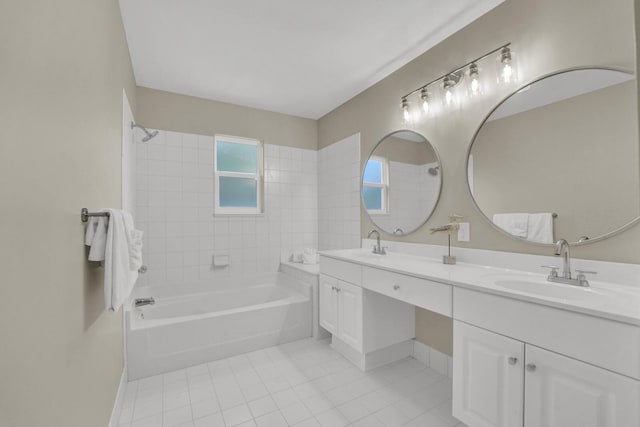 full bath with a sink, bathtub / shower combination, double vanity, and tile patterned floors