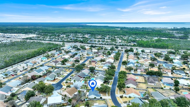 birds eye view of property featuring a residential view and a water view