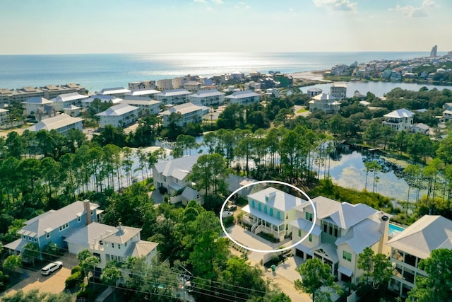 drone / aerial view with a residential view and a water view