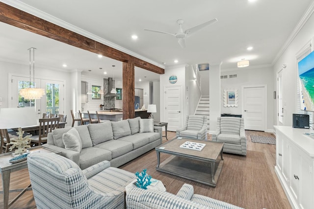 living room featuring recessed lighting, stairway, visible vents, and ornamental molding