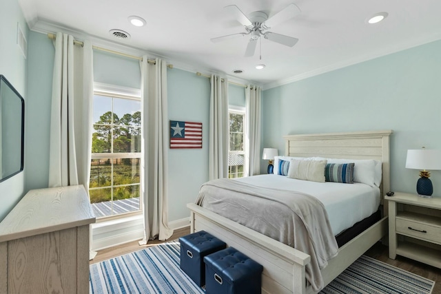 bedroom featuring recessed lighting, wood finished floors, visible vents, and baseboards