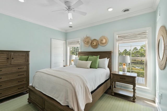 bedroom featuring visible vents, ornamental molding, recessed lighting, light wood finished floors, and baseboards