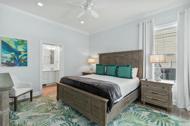 bedroom with baseboards, ornamental molding, recessed lighting, ensuite bathroom, and wood finished floors