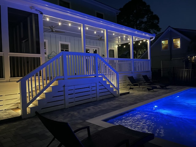 exterior space featuring stairs, fence, a patio area, and a fenced in pool