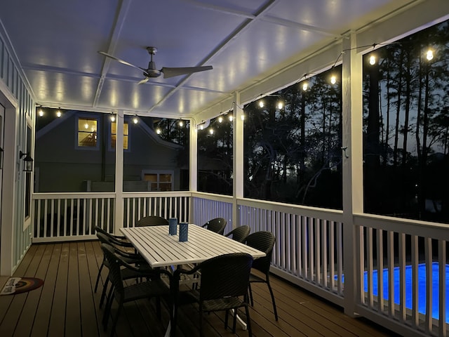 sunroom featuring ceiling fan