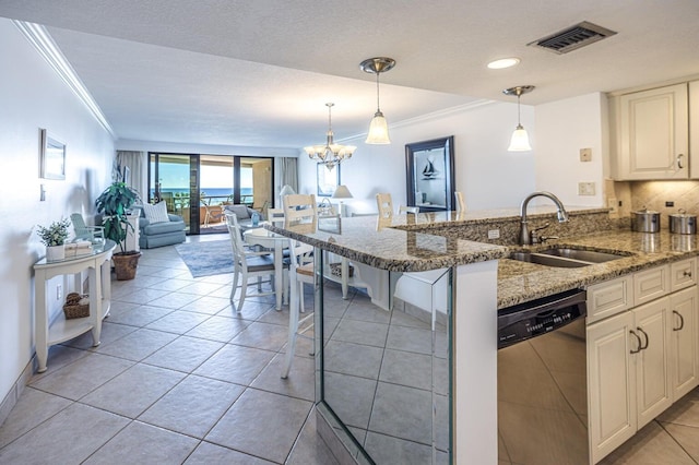 kitchen featuring stainless steel dishwasher, ornamental molding, visible vents, and a sink