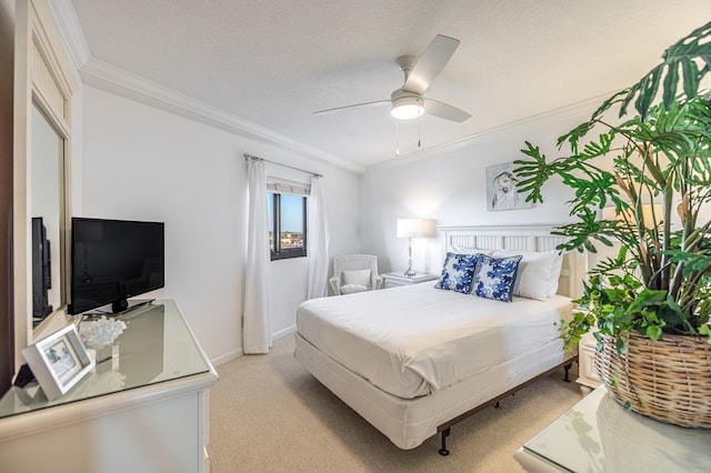 bedroom featuring baseboards, light carpet, a textured ceiling, and ornamental molding