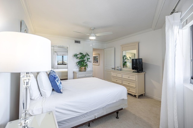 bedroom with visible vents, light carpet, ornamental molding, baseboards, and ceiling fan