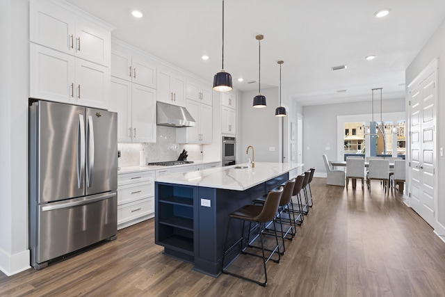 kitchen featuring tasteful backsplash, under cabinet range hood, appliances with stainless steel finishes, white cabinetry, and open shelves