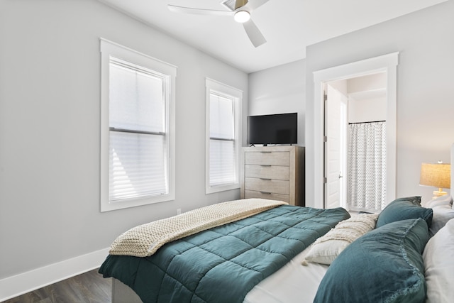 bedroom featuring a ceiling fan, baseboards, and dark wood-style flooring