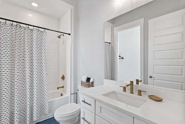 bathroom featuring toilet, vanity, and shower / bath combo