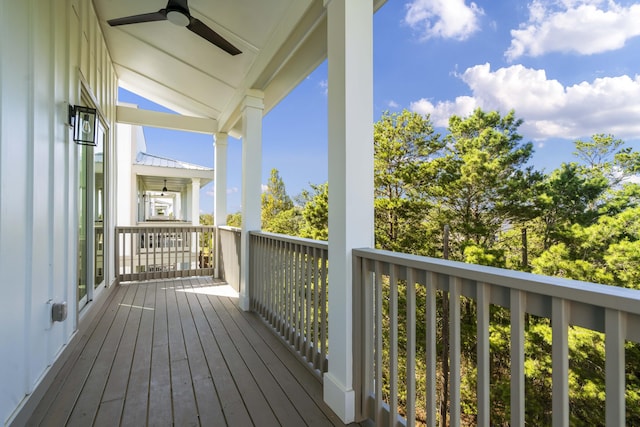 wooden terrace featuring ceiling fan