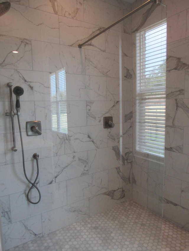 full bath with tiled shower