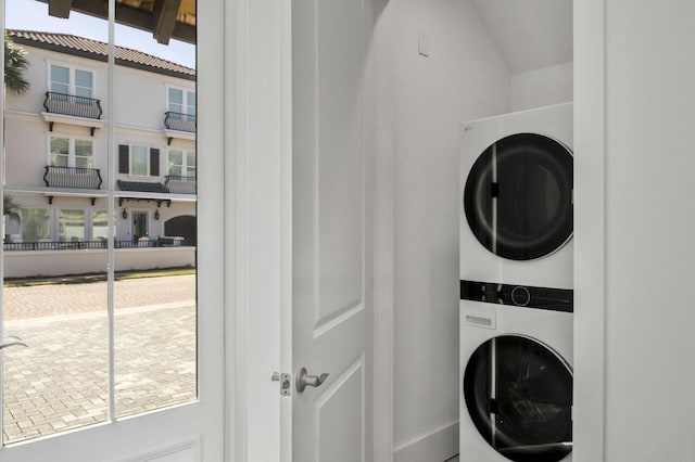 washroom with laundry area and stacked washer and clothes dryer