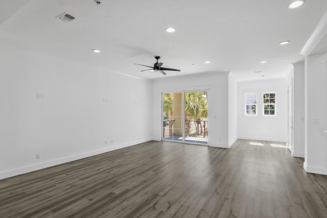 unfurnished living room featuring dark wood-style floors, visible vents, a ceiling fan, baseboards, and recessed lighting