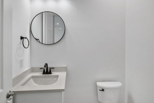 half bath with toilet and vanity