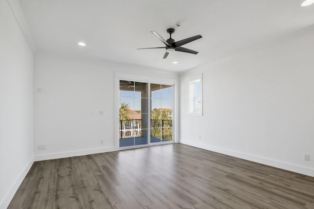 unfurnished room featuring baseboards, wood finished floors, a ceiling fan, and ornamental molding