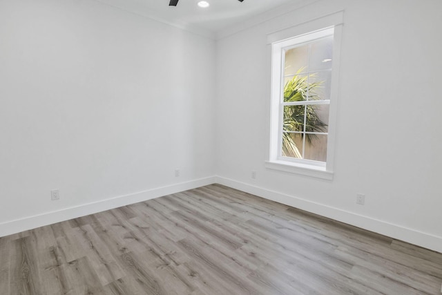 unfurnished room with recessed lighting, wood finished floors, baseboards, and ceiling fan