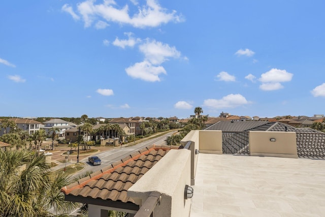 exterior space with a balcony and a residential view