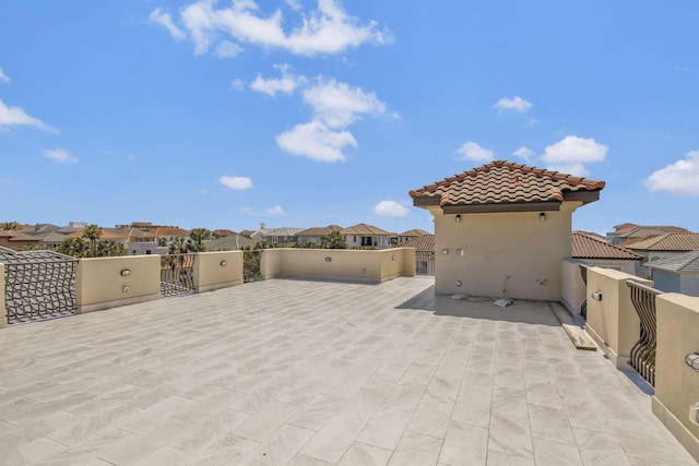 view of patio featuring a residential view and a balcony