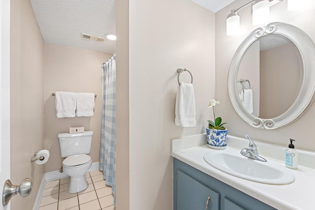 bathroom featuring vanity, visible vents, a textured ceiling, tile patterned floors, and toilet