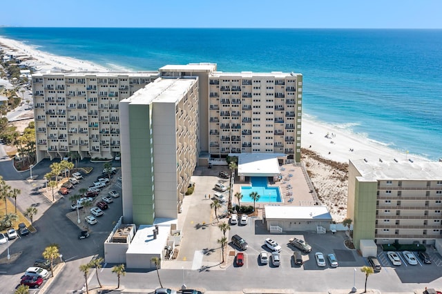 aerial view featuring a water view and a view of the beach