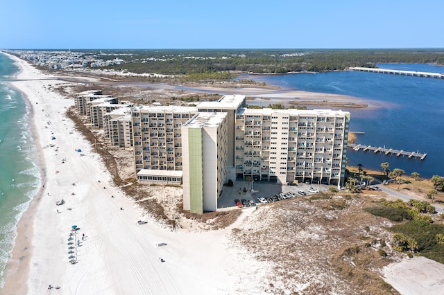 bird's eye view featuring a water view and a beach view