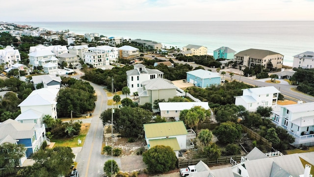 drone / aerial view featuring a residential view and a water view