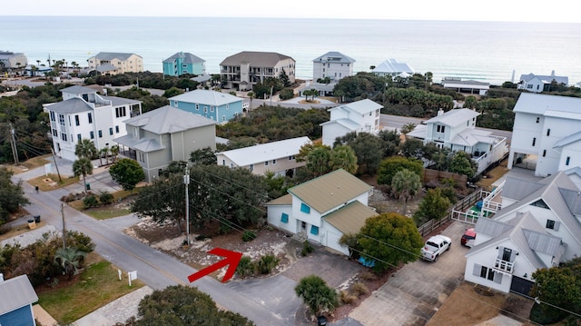 drone / aerial view with a residential view and a water view