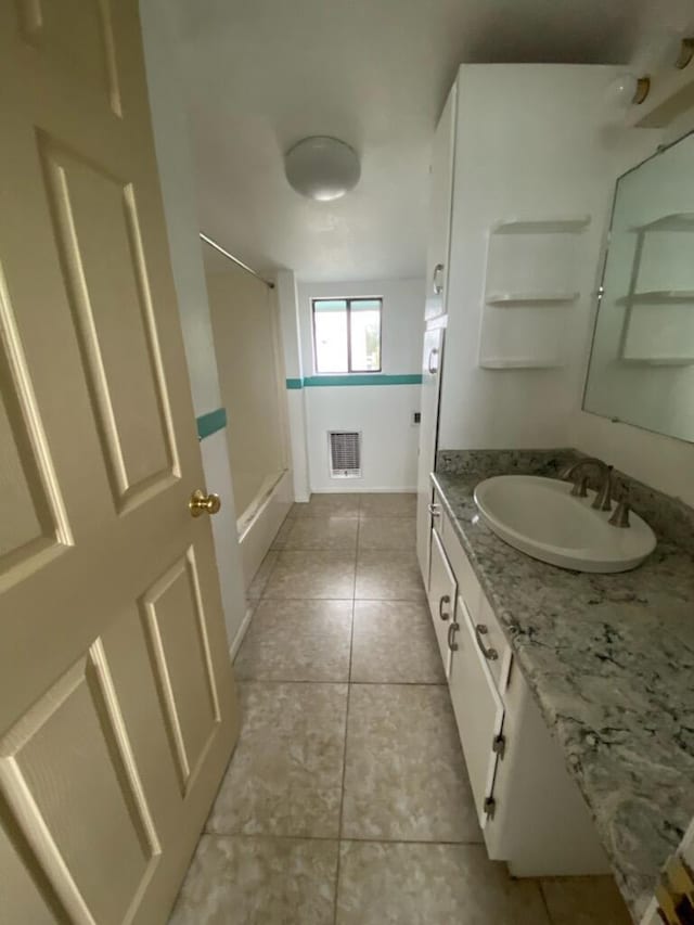 full bath featuring tile patterned floors, visible vents, vanity, and shower / bath combination