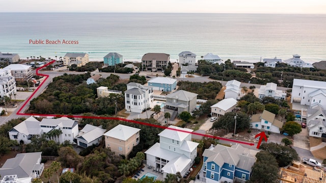 bird's eye view featuring a residential view and a water view