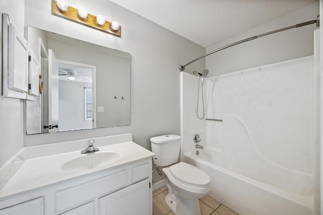 bathroom with tile patterned flooring, toilet, vanity, shower / bathing tub combination, and a textured ceiling