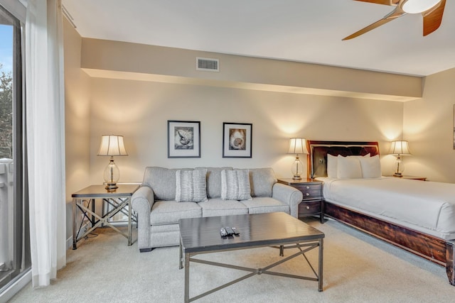 bedroom featuring carpet flooring, a ceiling fan, and visible vents