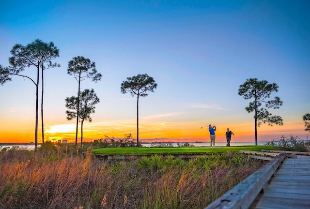 surrounding community with a water view