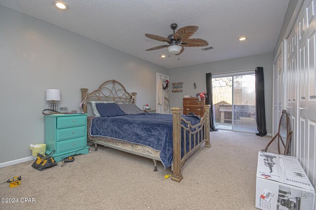 bedroom featuring light carpet, recessed lighting, a textured ceiling, and access to outside