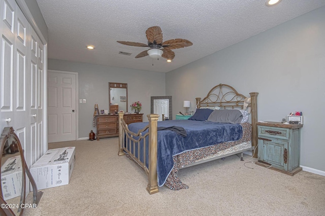 bedroom featuring visible vents, a textured ceiling, recessed lighting, carpet flooring, and baseboards