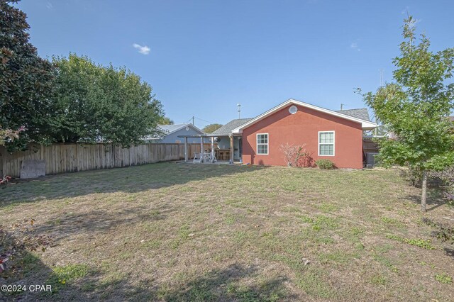 view of yard with a patio area and a fenced backyard