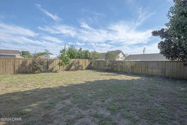 view of yard with a fenced backyard