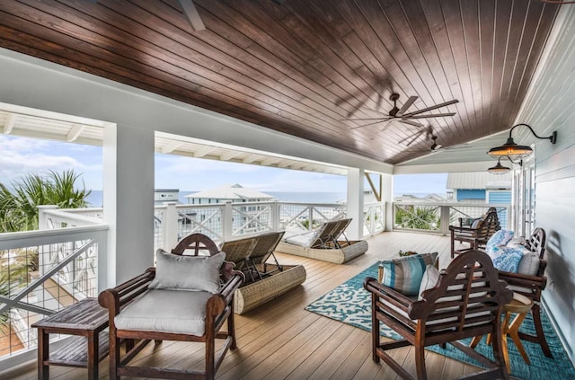 wooden deck featuring ceiling fan and outdoor lounge area