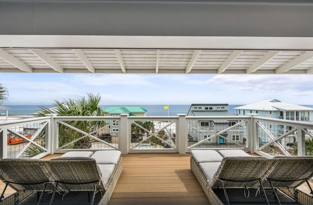 wooden deck with a water view